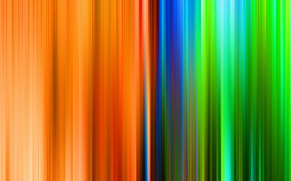 Abstraktes Bild aus dicht nebeneinander stehenden vertikalen Linien, links in Orange und Gelb, rechts in Blau und Grün, mit weichen Farbverläufen und unscharfen Übergängen.