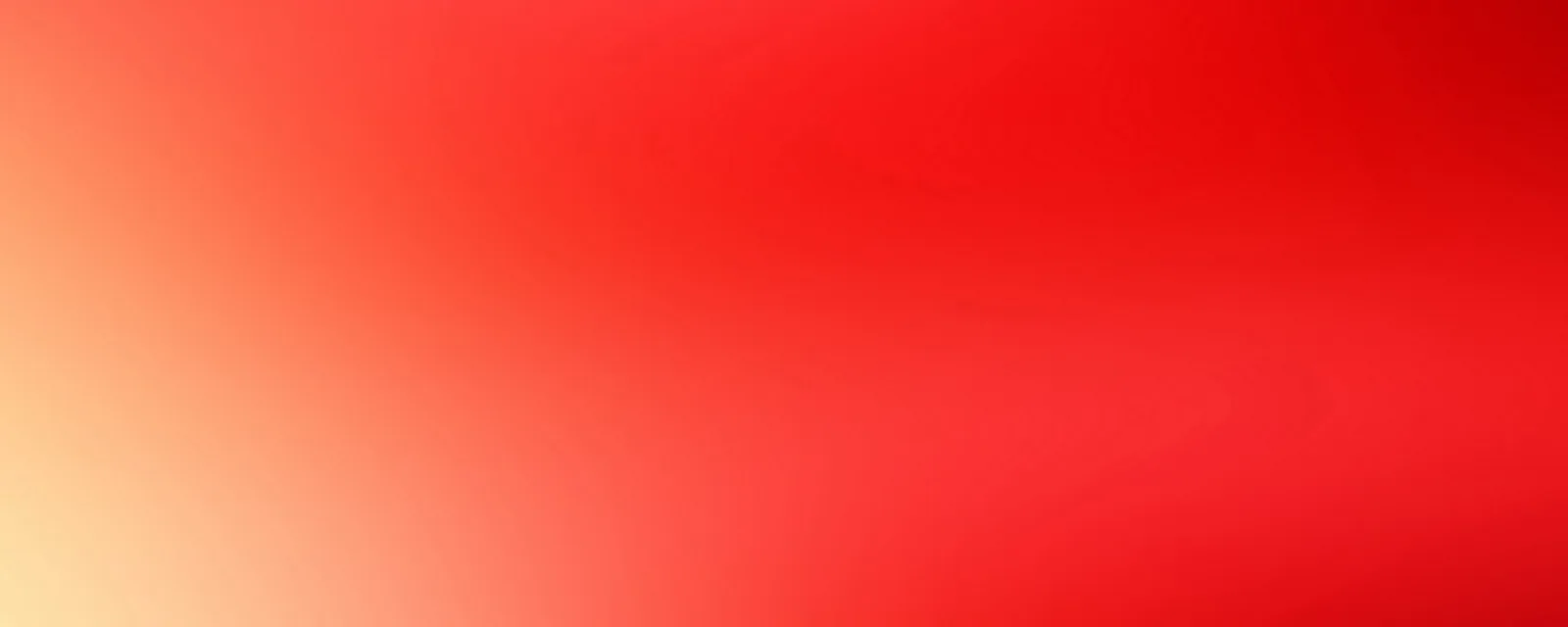 Weicher Farbverlauf von cremefarbenem Gelb links unten über Orange zu kräftigem Rot und dunklerem Rot rechts oben.