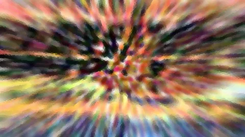 Abstrakte Komposition mit bunten, radial von der Mitte nach außen laufenden Farbstrahlen in Rot, Gelb, Grün und Violett, unscharf und mosaikartig gerastert.