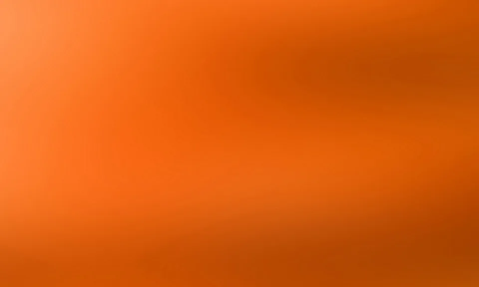 Weicher Farbverlauf in Orange, heller im linken oberen Bereich und dunkler zur rechten Seite und nach unten hin.