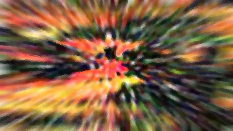 Abstraktes Bild mit radial von der Mitte nach außen laufenden Streifen in Rot, Orange, Gelb und Grün, dunkler Kern in der Mitte.
