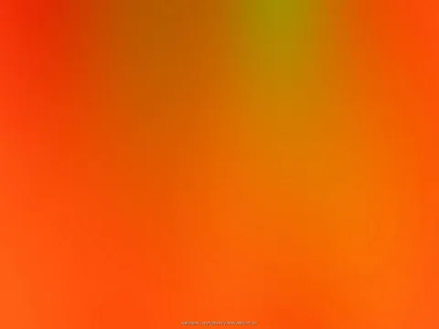 Weicher orangefarbener Farbverlauf mit einem gelblich-grünen Lichtschimmer oben in der Mitte.