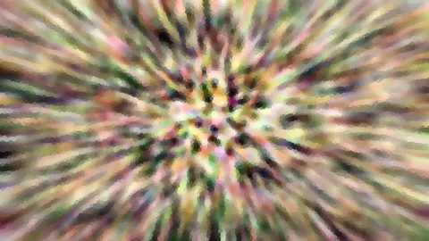 Abstraktes Bild aus farbigen Streifen, die von einem hellen Zentrum radial nach außen laufen, mit grober mosaikartiger Pixelstruktur.