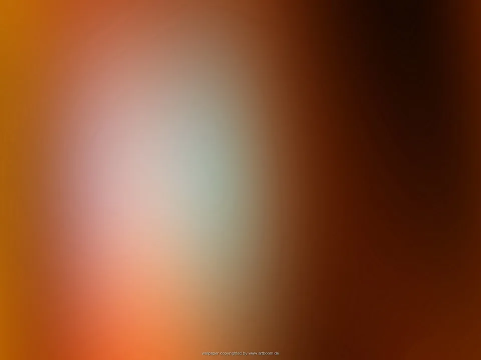 Unscharfer Farbverlauf von Orange über Braun, links ein heller, grünlich-weißer Lichtfleck, rechts fast schwarzbraun.