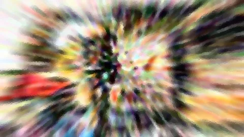 Abstraktes Bild mit radial von der Mitte nach außen laufenden Farbstrahlen in Rot, Gelb, Grün und Violett, leicht verpixelt.