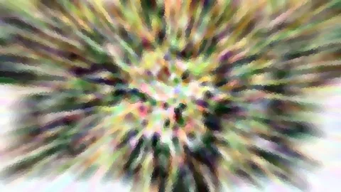 Abstrakte Komposition aus bunten Schlieren, die von einem hellen Zentrum radial nach außen laufen, grob gepixelt.