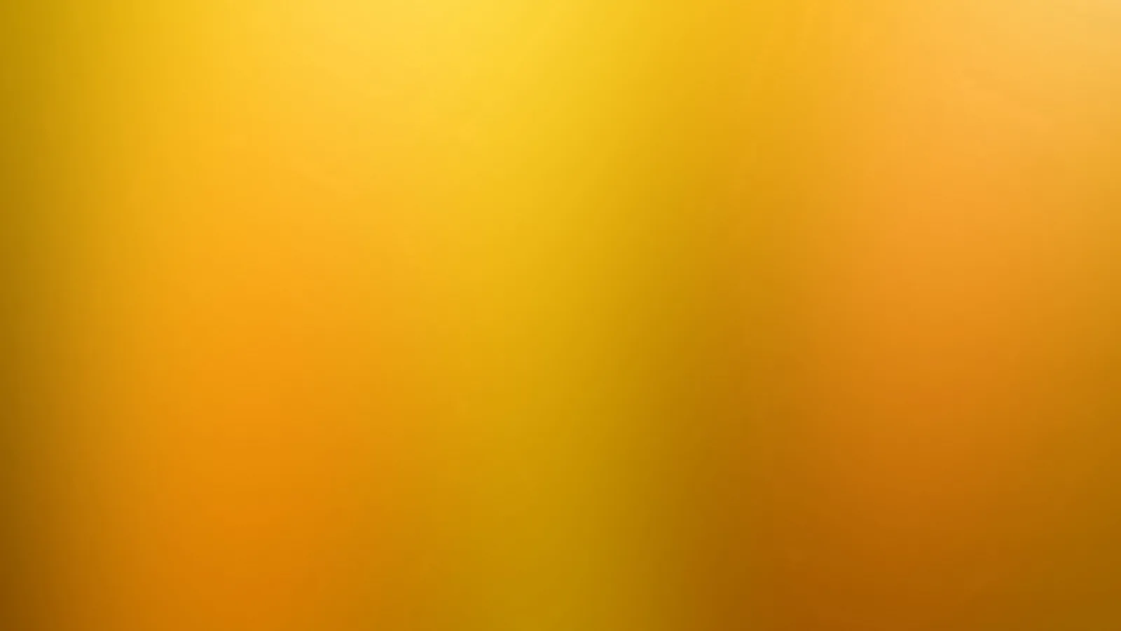 Weicher Farbverlauf von Gelb in der Mitte über Orange bis Goldbraun an den Rändern, ohne erkennbare Formen.