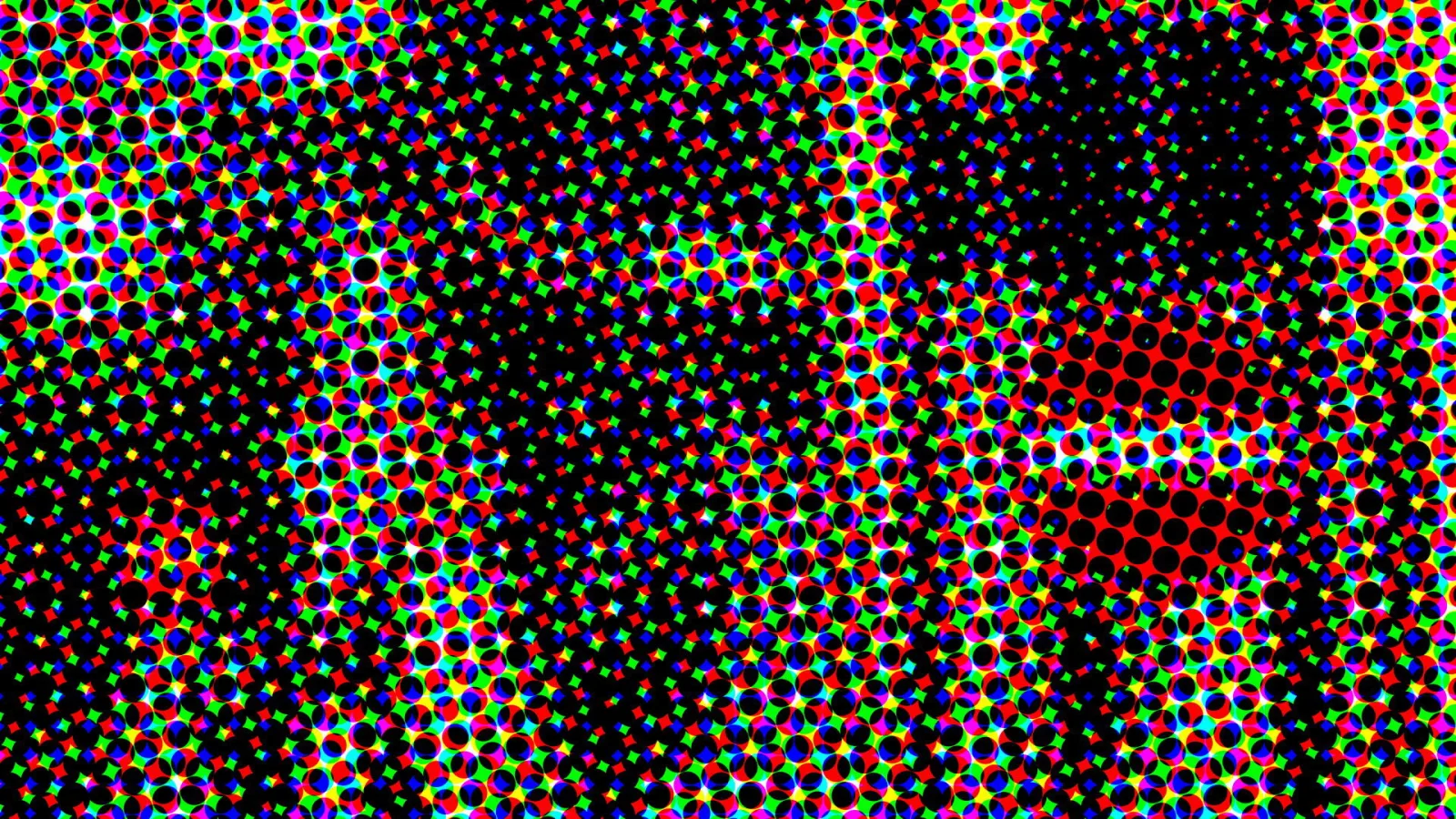 Dichtes Raster aus bunten RGB-Punkten auf schwarzem Grund, im Zentrum und rechts unten mit roten Feldern.
