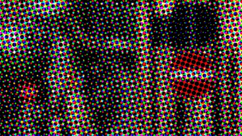 Dichtes Raster aus bunten RGB-Punkten auf schwarzem Grund, im Zentrum und rechts unten mit roten Feldern.