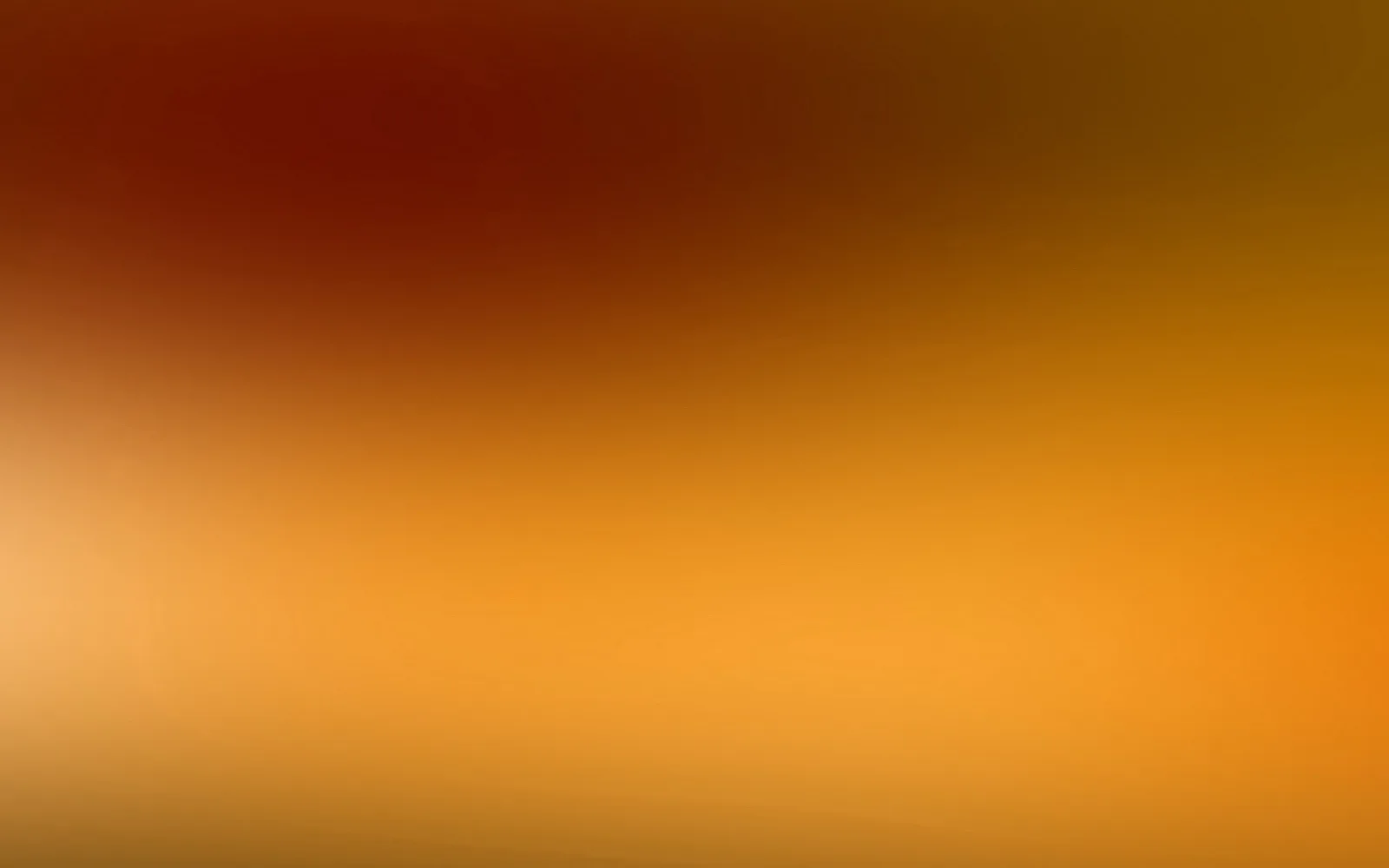 Unscharfer Farbverlauf von dunklem Rot oben links über Orange bis zu hellem Gelb unten links.