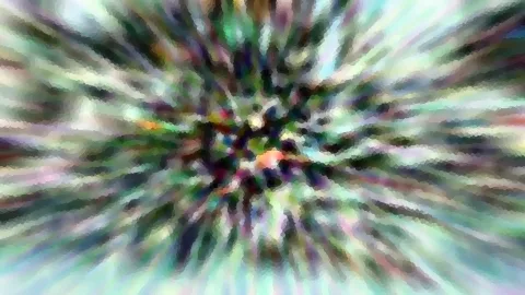 Abstraktes Bild mit radialer Bewegungsunschärfe und Mosaikeffekt, Farbstreifen in Grün, Violett und Weiß laufen von einem bunten Zentrum nach außen.