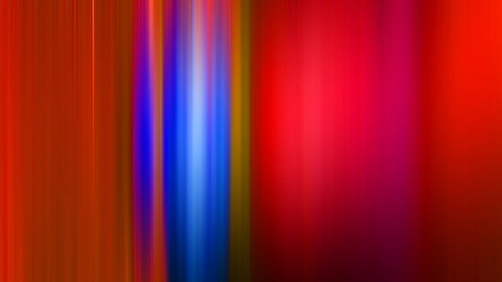 Abstrakte vertikale Schlieren in Rot, Magenta, Blau und Orange, die sich von links nach rechts ziehen.