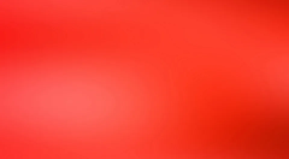 Ein nahezu gleichmäßiger roter Farbverlauf mit hellerem Bereich links der Mitte und dunklerem Rot rechts unten.