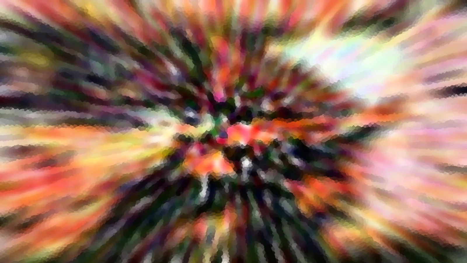 Bunte, radial verwischte Farbstrahlen laufen von einem hellen Zentrum in der Bildmitte nach außen.