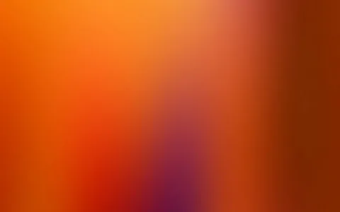 Weicher Farbverlauf in Orange und Rot, unten in der Mitte ein violetter Fleck, rechts dunkler werdend ins Braunrot.