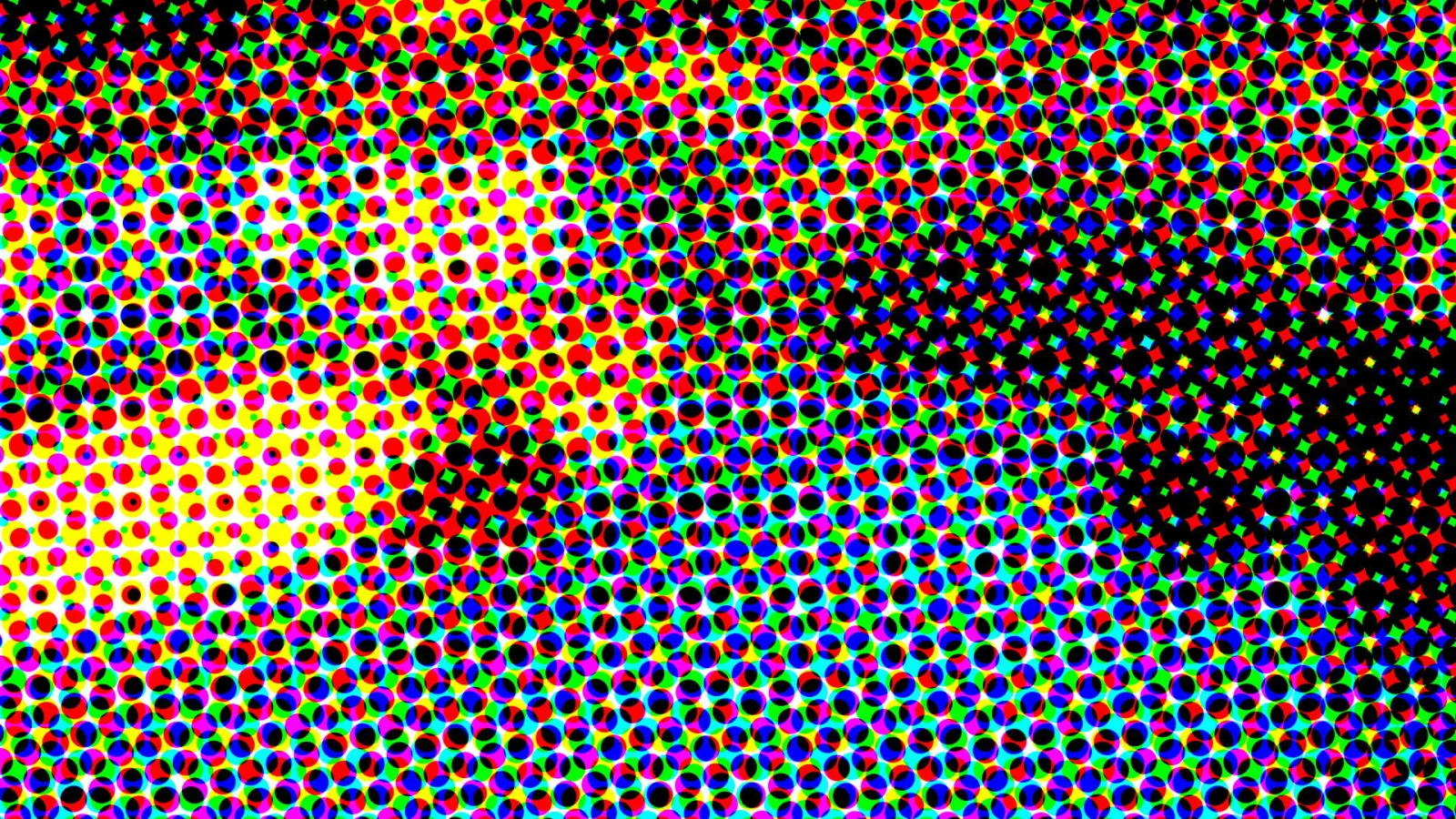 Dichtes Raster aus bunten Punkten in Rot, Grün, Blau, Gelb und Schwarz, links hell und gelb, rechts fast schwarz.