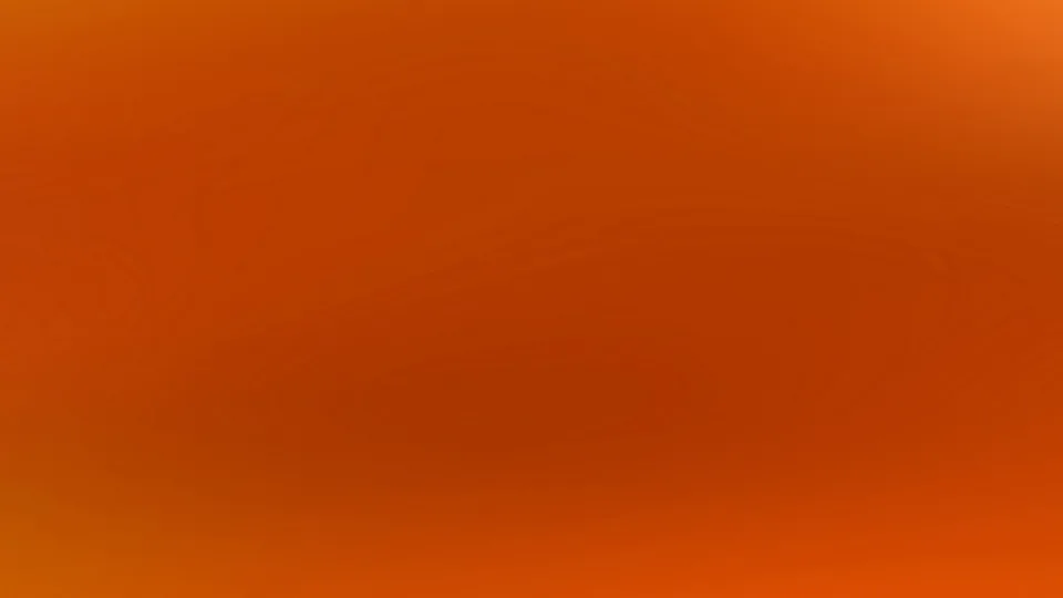 Weicher Farbverlauf in Orange- und Rottönen, heller im oberen rechten Bereich und dunkler in der Mitte.