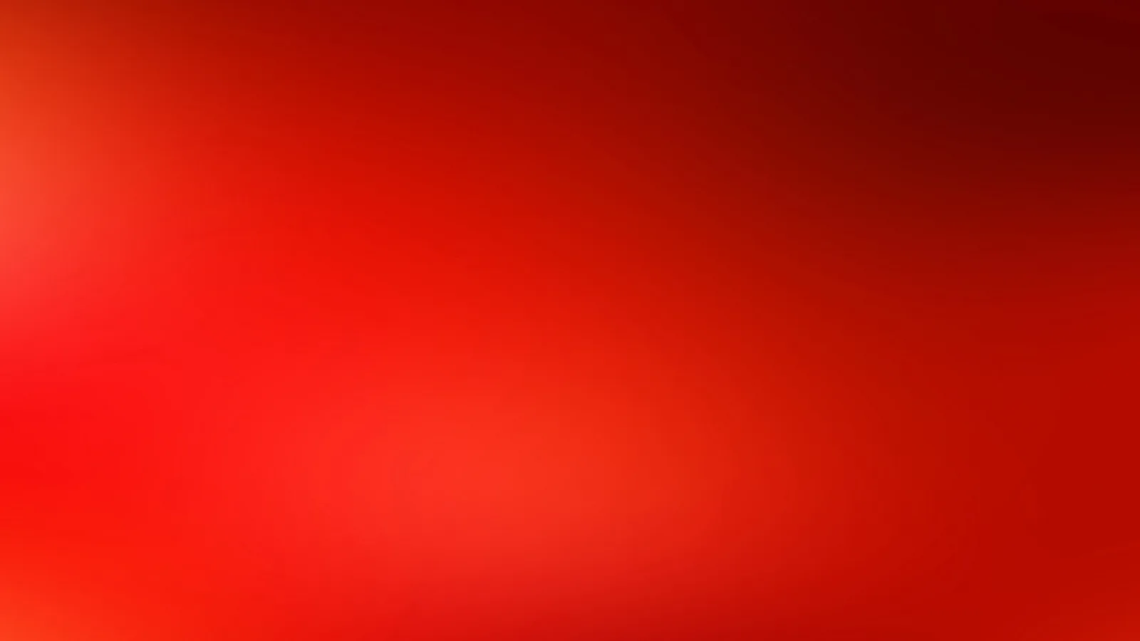 Unscharfer Verlauf in Rot- und Orangetönen, heller links oben, dunkler rechts oben