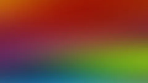 Unscharfer Farbverlauf von Rot und Orange oben über Violett bis Grün und Blau unten, ohne erkennbares Motiv.