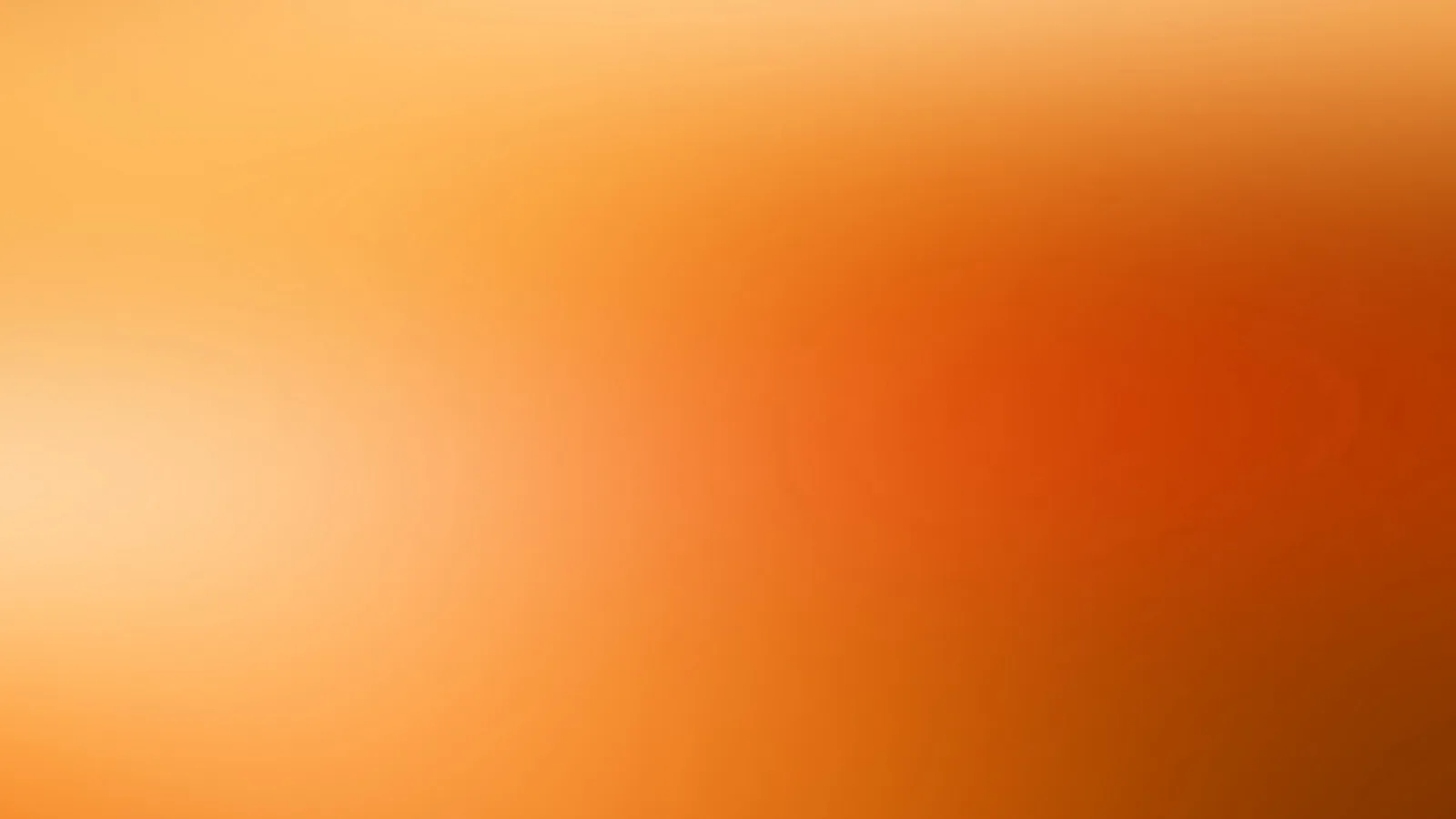 Unscharfer Farbverlauf in Orange, links heller und cremefarben, rechts tiefes Rotorange