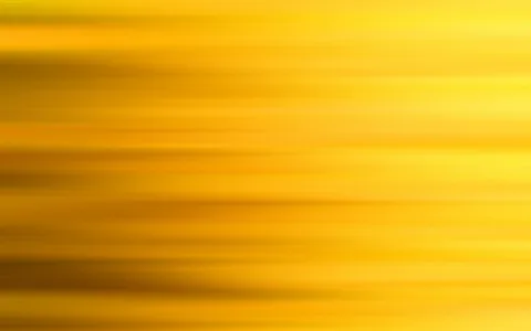 Horizontal verwischte Streifen in Gelb und Orange, die von dunkleren Bereichen links zu helleren Partien rechts übergehen.