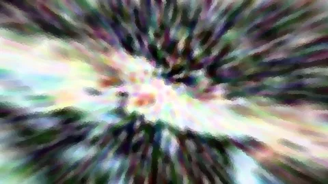 Abstraktes Bild mit bunten, verwischten Farbstrahlen, die von einer hellen Mitte nach außen laufen, grobes Mosaik-Muster.