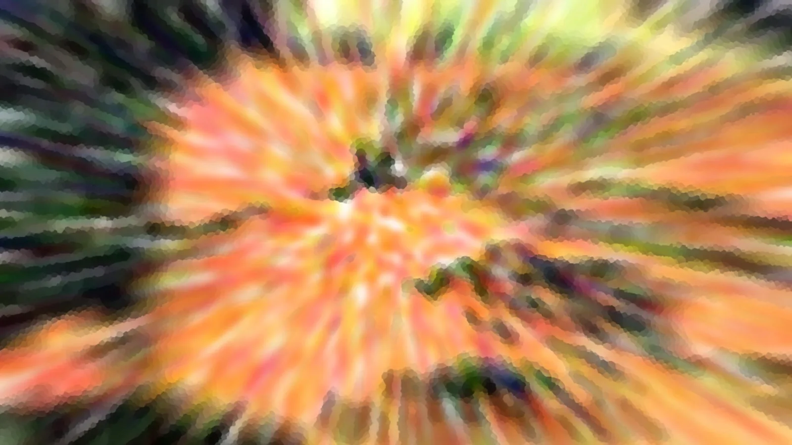 Stark verwischte Aufnahme mit radialen Schlieren in Orange, Gelb und Dunkelgrün, die von einem hellen Zentrum nach außen laufen.