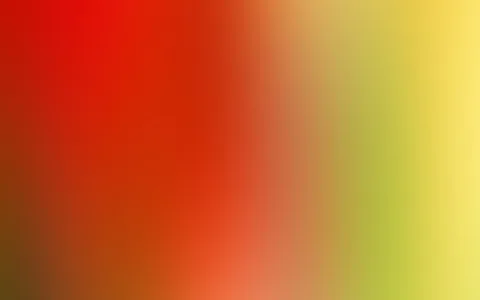 Unscharfer Farbverlauf von Rot links über Orange und Ocker bis Gelb rechts, mit grünlichen Tönen am rechten Rand.