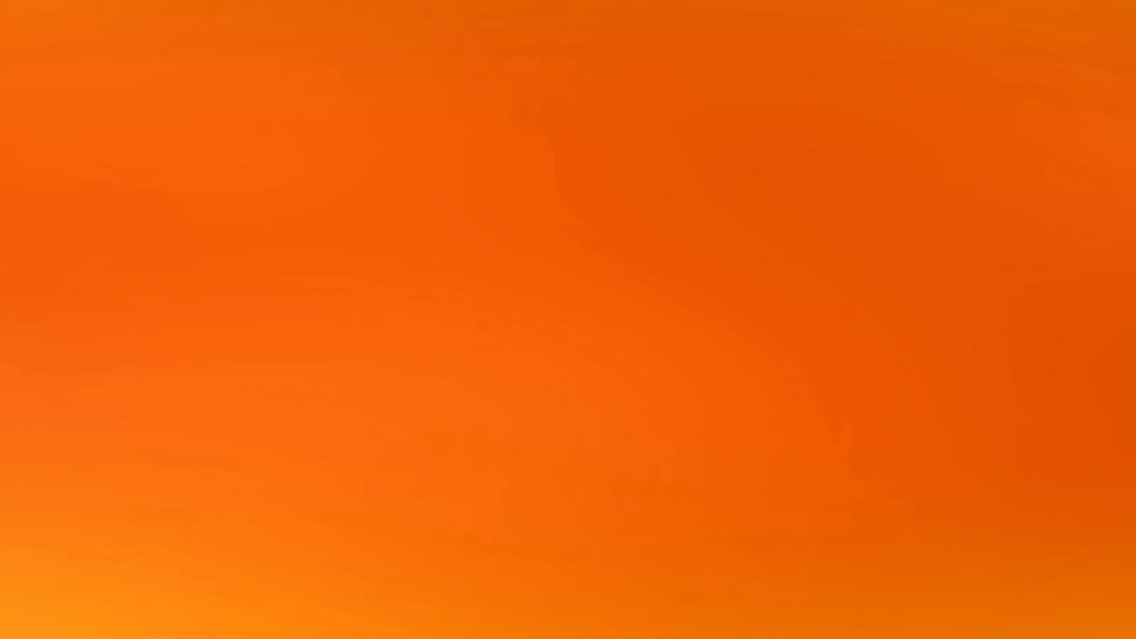 Unscharfer Verlauf in Orange, von hellerem Gelb am unteren Rand zu tieferem Rotorange oben.