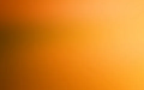 Unscharfer Farbverlauf von dunklem Braunorange links zu hellem Gelborange rechts, ohne erkennbare Motive.