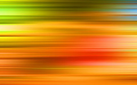 Abstrakte horizontale Streifen in Grün, Gelb, Orange und Rot, die wie eine Bewegungsunschärfe von links nach rechts verlaufen.