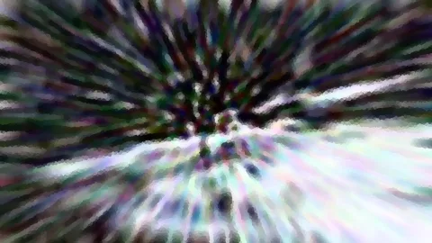 Abstraktes Bild mit radialer Unschärfe, die von der Mitte nach außen strahlt, in Grün, Violett und Weiß mit pixeligen Blockstrukturen.