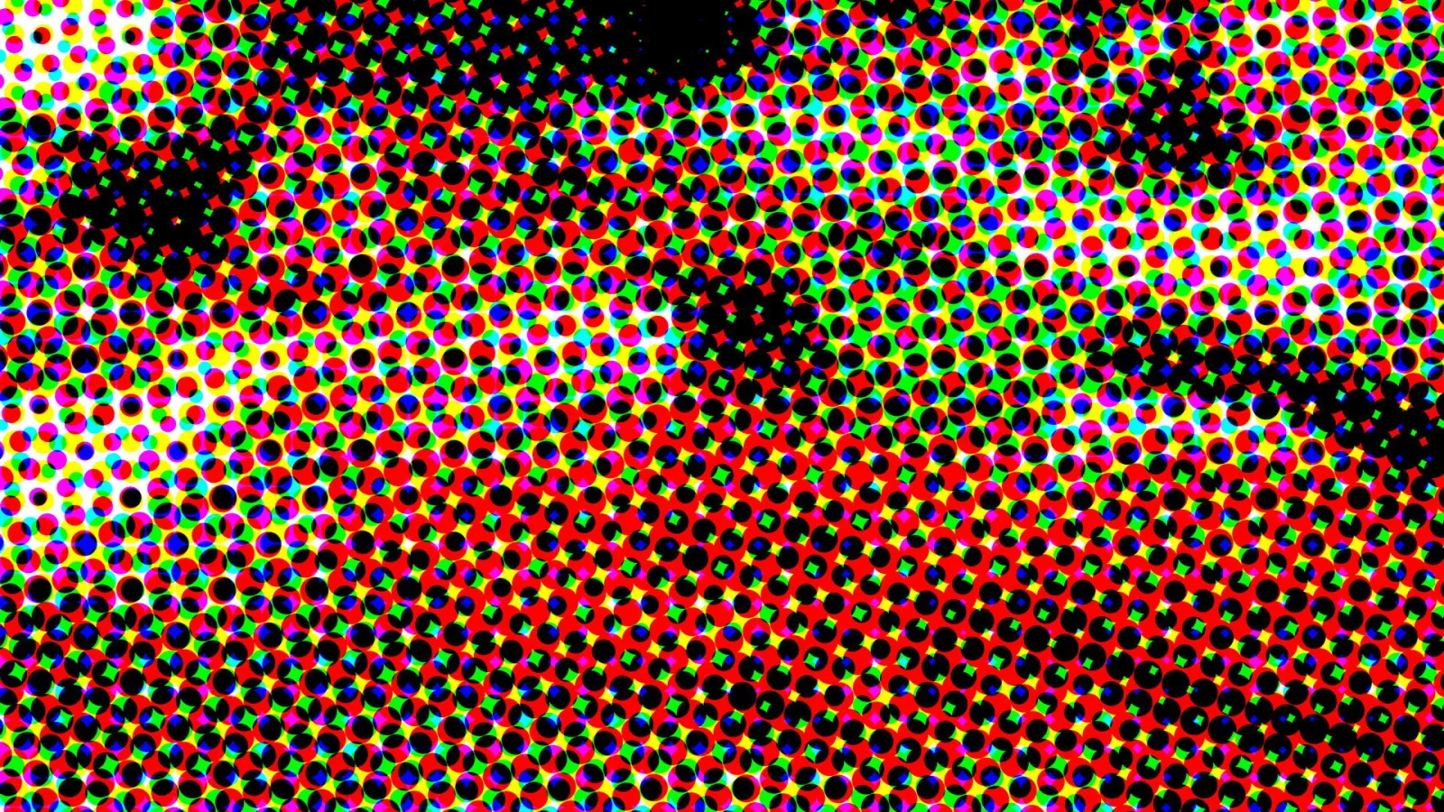 Dichtes Raster aus bunten Punkten in Rot, Grün, Gelb, Blau und Magenta, durchsetzt von schwarzen Flecken