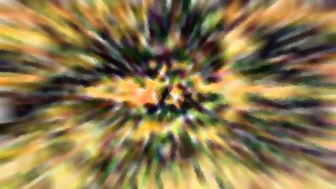 Abstrakte radiale Unschärfe mit gelben, grünen, orangefarbenen und dunklen Streifen, die vom Zentrum nach außen laufen, mosaikartig gepixelt
