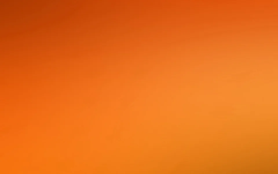 Unscharfer Farbverlauf von dunklem Rotorange oben links zu hellem Orange unten rechts