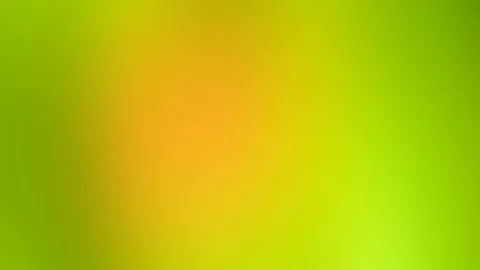 Unscharfer Farbverlauf mit einem warmen orangefarbenen Zentrum, das nach außen in gelbes und grünes Licht übergeht.