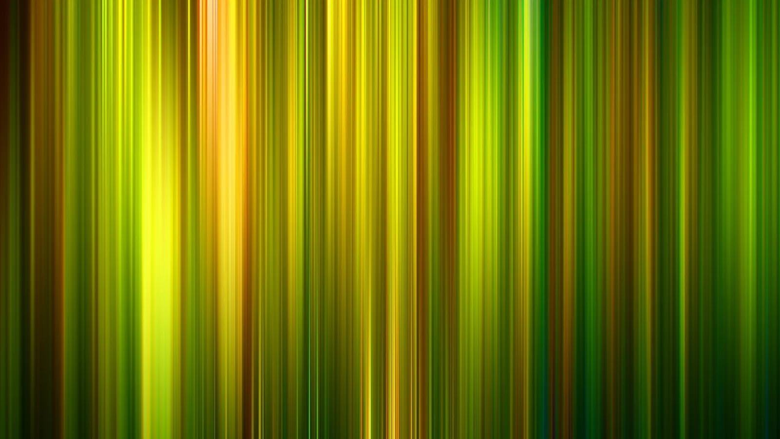 Vertikale, verwischte Linien in Gelb, Grün und Orange auf dunklem Grund, in der Mitte und links heller leuchtend.