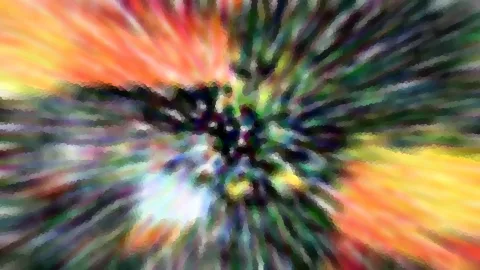 Abstrakte Komposition aus radial von der Mitte nach außen laufenden Farbstreifen in Orange, Gelb, Grün und Weiß, im Zentrum dunkel und unscharf.