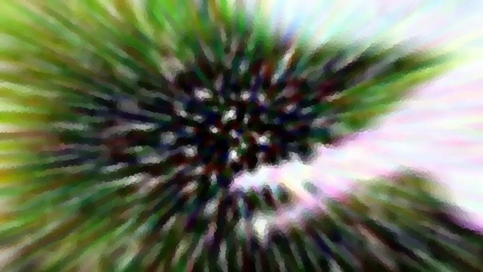 Abstrakte Aufnahme mit radialer Bewegungsunschärfe: Grüne, violette und weiße Streifen laufen von einem dunklen Zentrum nach außen.