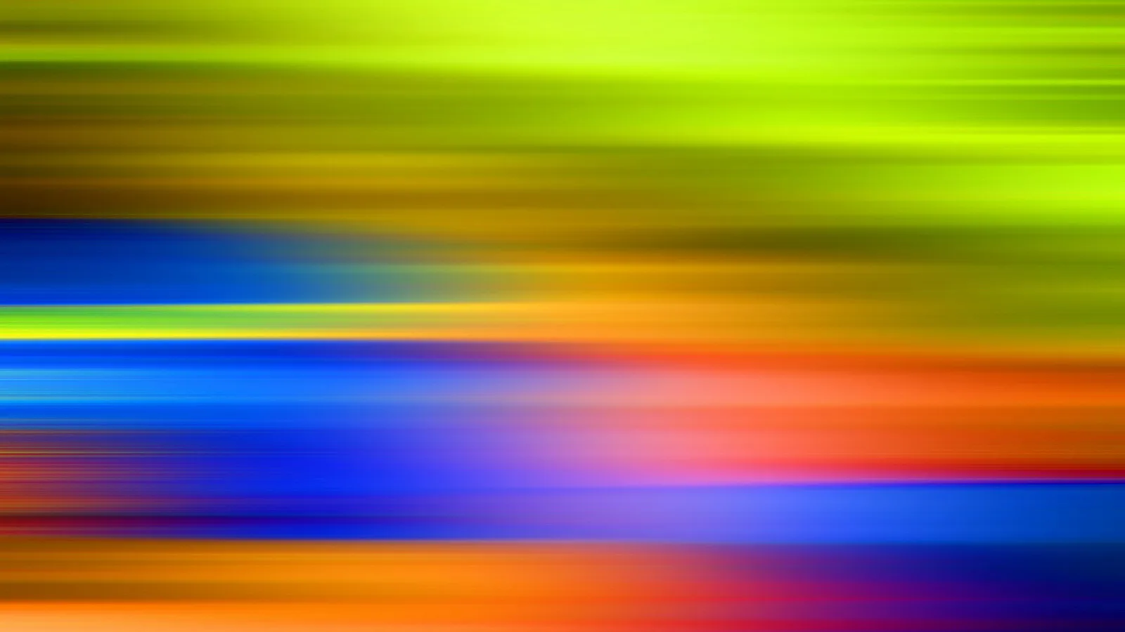 Horizontal verwischte Farbstreifen in Gelbgrün, Blau, Orange und Rot.