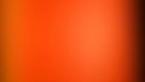 Unscharfer Verlauf in Orange und Rot, heller im Zentrum, zum rechten Rand hin dunkel werdend.