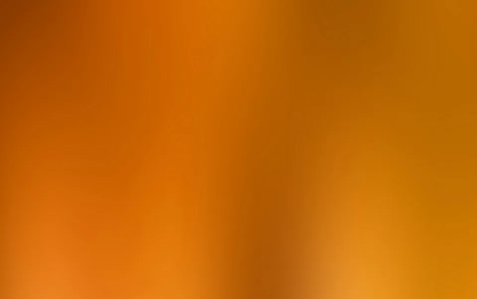 Unscharfer Verlauf in Orange- und Brauntönen, von dunklem Ocker links oben bis zu hellem Gelb rechts unten.