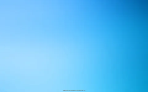 Ein gleichmäßiger Verlauf von hellem Himmelblau links unten zu tiefem Blau rechts oben, ohne erkennbare Motive.