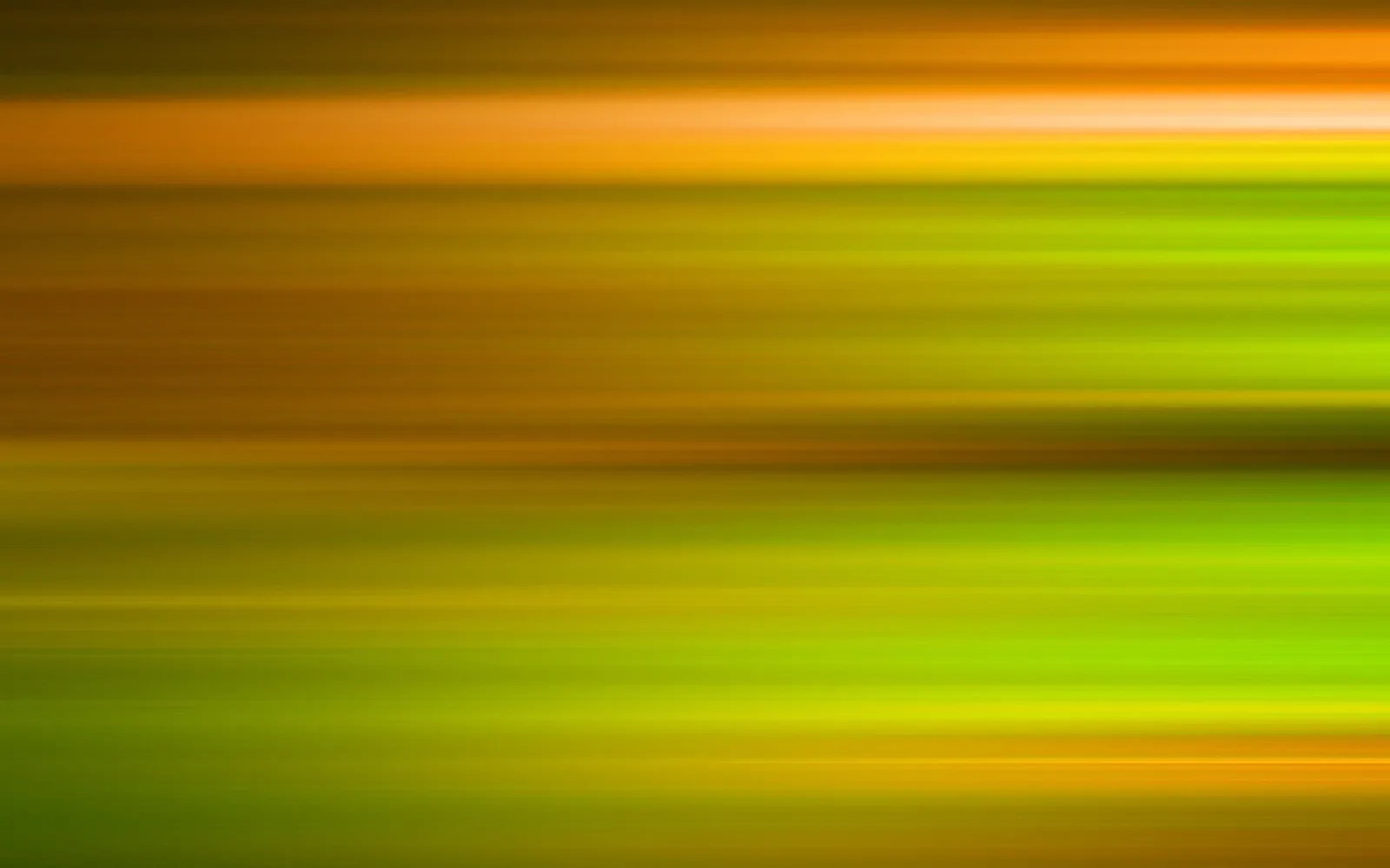 Abstrakte horizontale Streifen in Gelb, Orange und Grün, weich verwischt wie bei einer Bewegungsunschärfe.