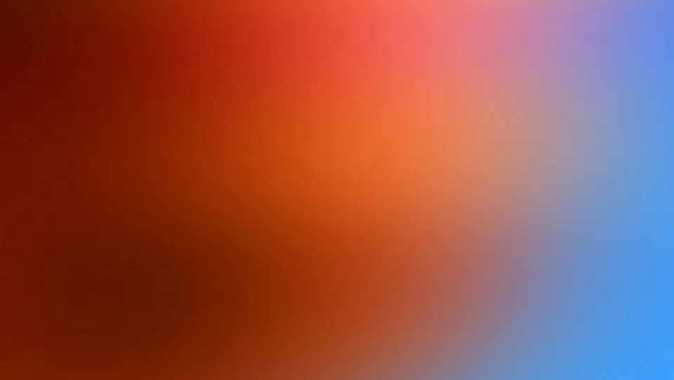 Weicher Farbverlauf: links dunkles Rotbraun, in der Mitte leuchtendes Orange, rechts Rosa übergehend in Hellblau.