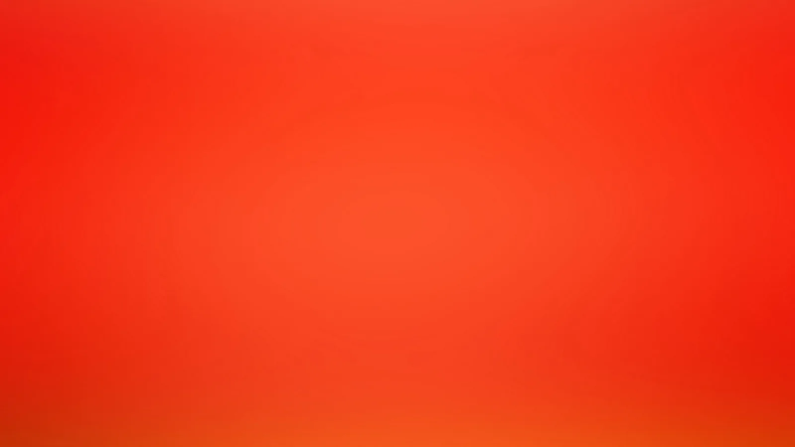 Unscharfer Verlauf in Rot- und Orangetönen, in der Mitte heller, an den Rändern dunkler.