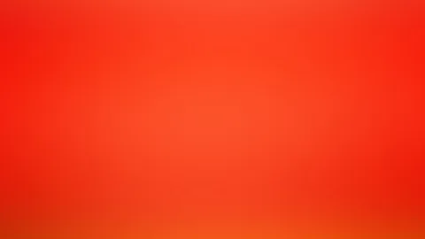 Unscharfer Verlauf in Rot- und Orangetönen, in der Mitte heller, an den Rändern dunkler.