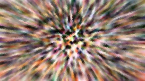 Bunte, radial verwischte Farbstreifen und kleine Mosaikpunkte laufen von einem dunklen Zentrum nach außen.