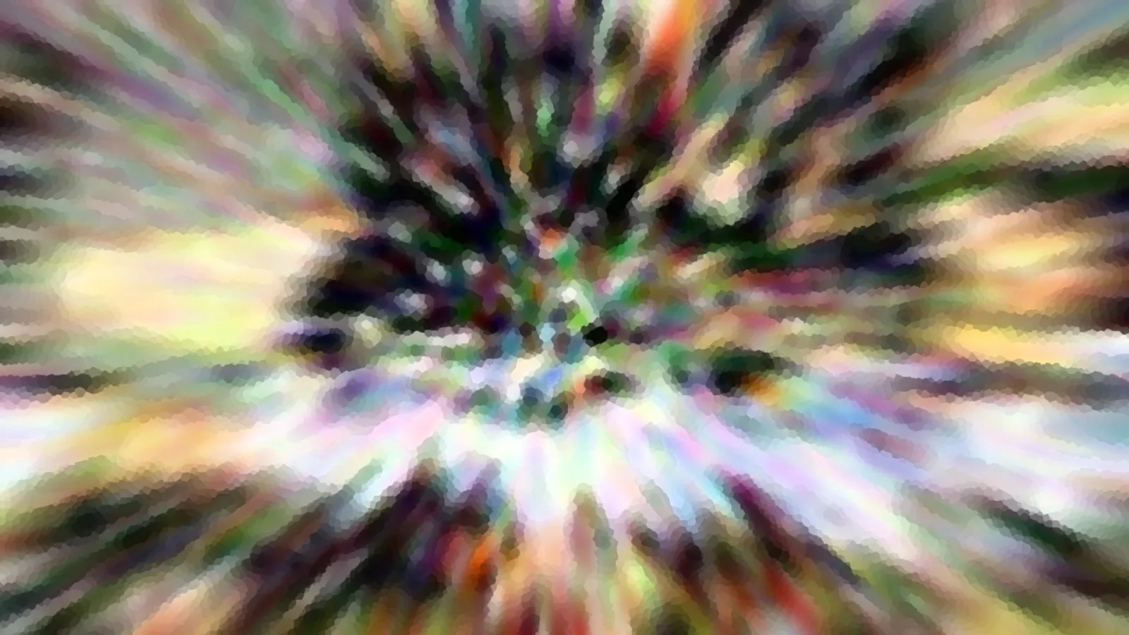 Abstrakte Aufnahme mit radial verlaufenden, bunten Schlieren, die von einem dunklen Zentrum nach außen strahlen.