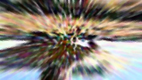 Abstraktes Bild mit radialer Bewegungsunschärfe in Regenbogenfarben, von der Mitte nach außen gestreift und pixelig gerastert.
